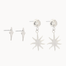white gold star-shaped studs and diamond and sun dangle earrings on a white background