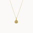 gold necklace with sunshine motif on a white background