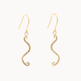 A pair of gold wavy dangle earrings with textured finishes and fishhook backings, shown against a plain off-white background.