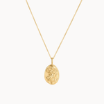 Gold virgo necklace with a pendant on a white background
