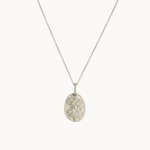 Silver virgo necklace with a oval pendant on a white background