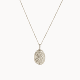 Silver virgo necklace with a oval pendant on a white background