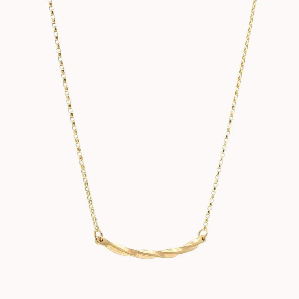 gold necklace with wavy curve pendant on white background