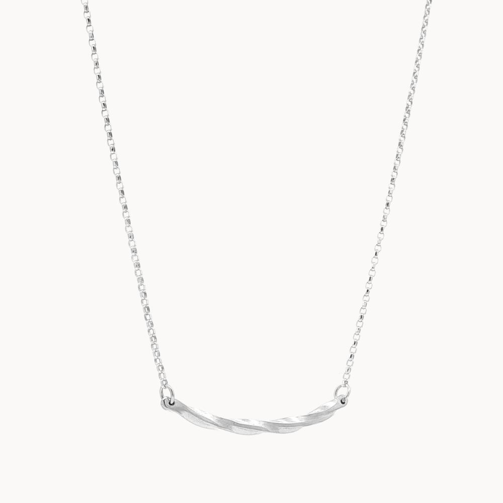 Silver necklace with a curved pendant on a white background