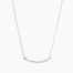 Silver necklace with a curved pendant on a white background