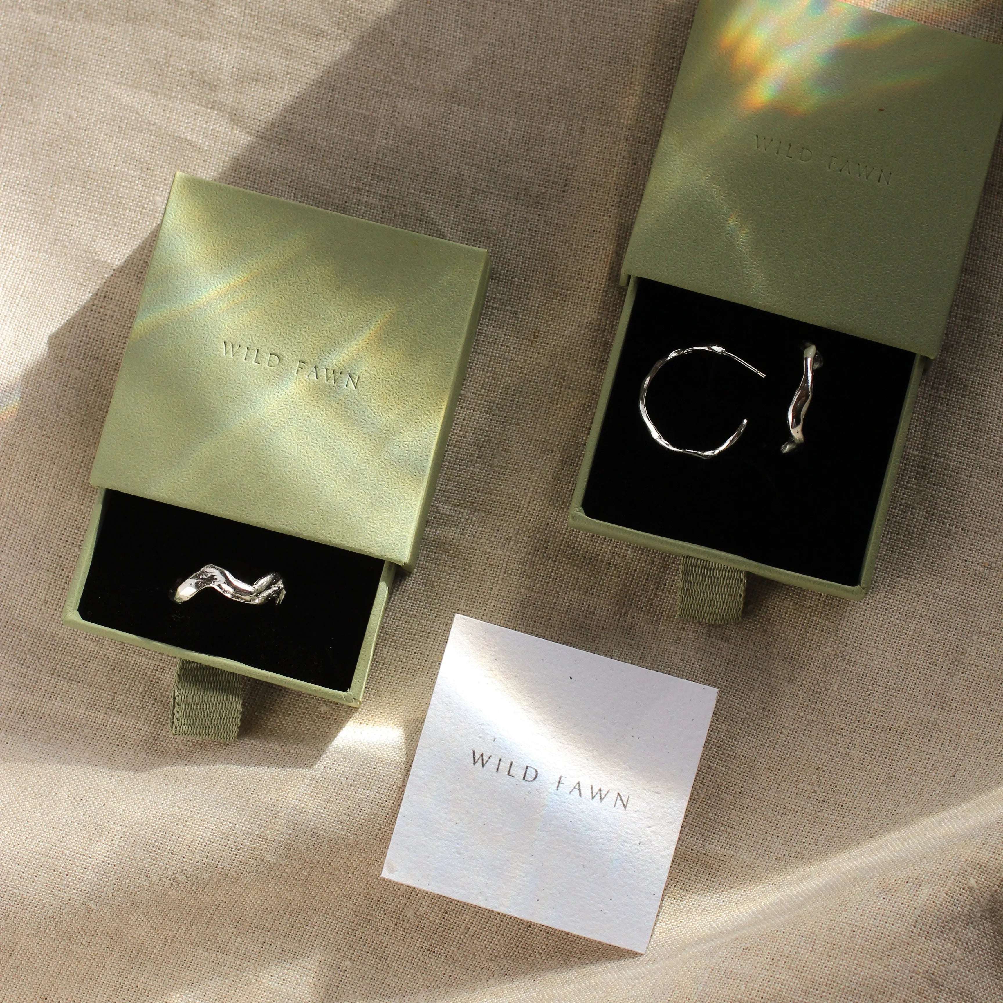 wave ring and hoops in green gift boxes and wild fawn care card