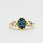 Yellow Gold Bezel Set Blue Sapphire Engagement Ring with Round Diamonds