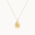 gold aries necklace with oval pendant on a white background