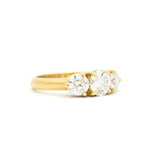 A yellow gold three-stone ring with round brilliant-cut diamonds and chunky 3mm band, shown on a clean white background.