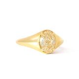 A yellow gold signet ring featuring a large, oval brilliant-cut yellow diamond center stone, shown on a clean white background.