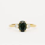 oval sapphire engagement ring on white background