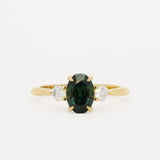 oval sapphire engagement ring on white background