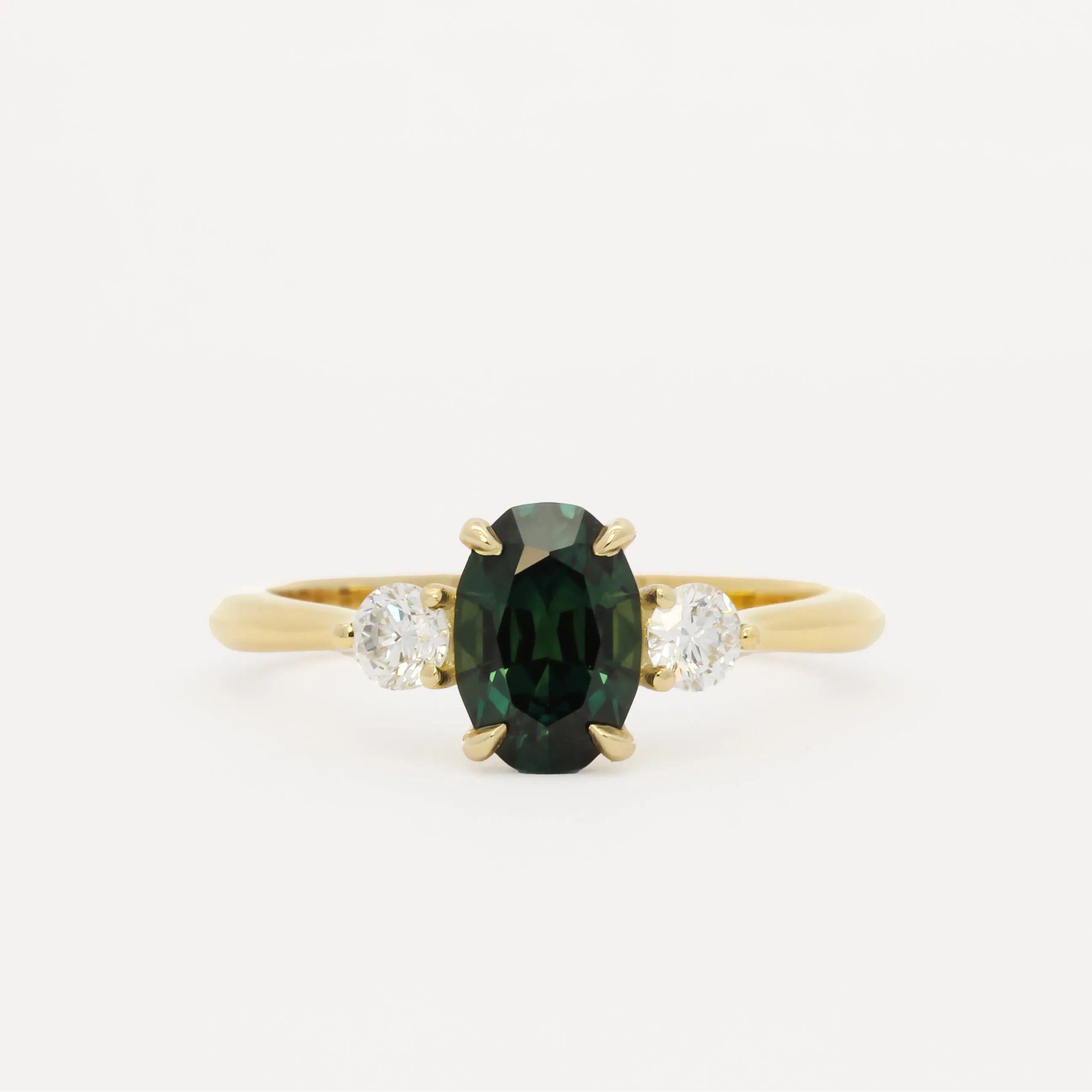 oval sapphire engagement ring on white background