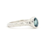 white gold Solitaire Blue Sapphire Molten Organic Engagement Ring side view on a white background