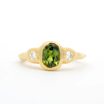 yellow gold Oval Green Sapphire Molten Organic Engagement Ring with round diamonds on a white background