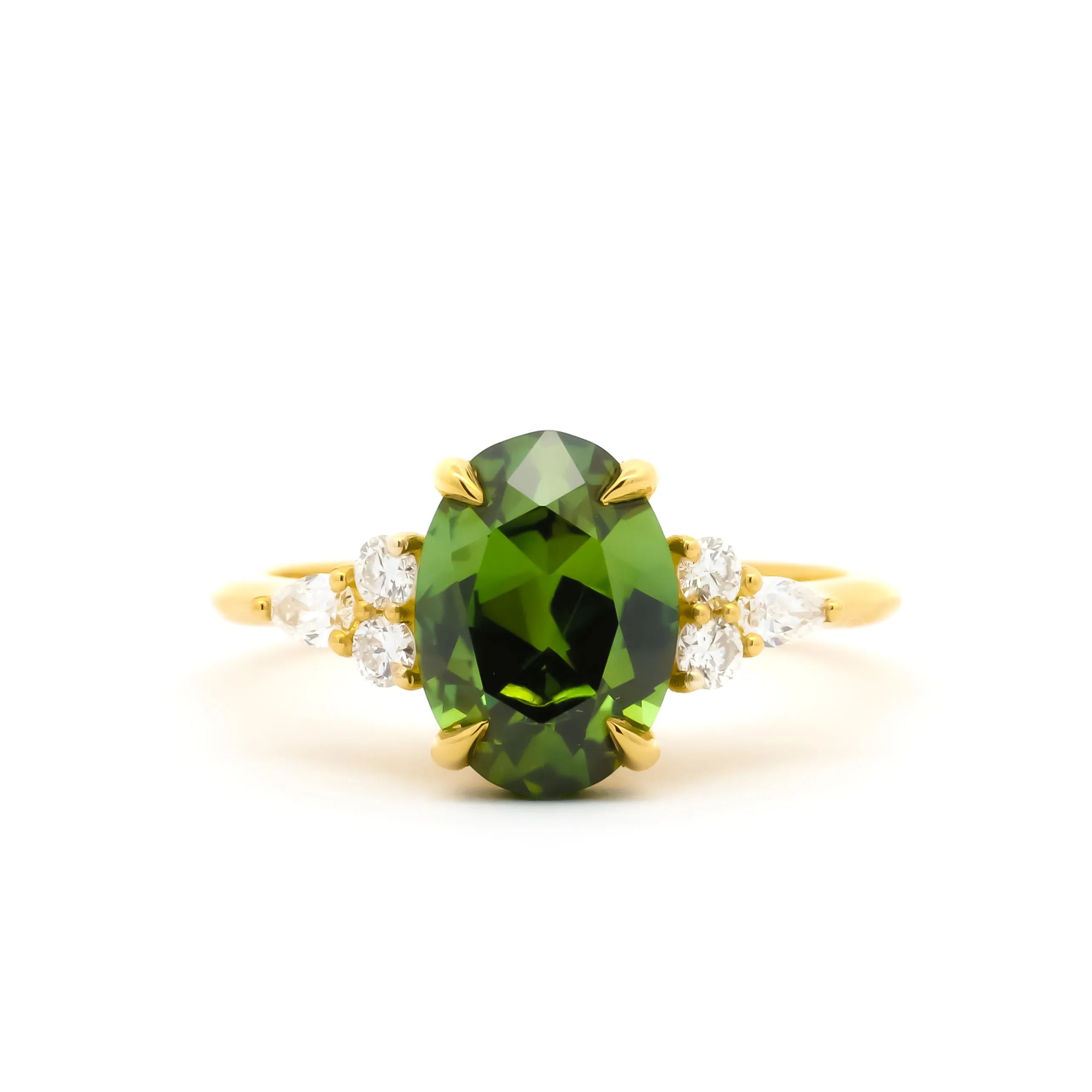 Large Green Sapphire Engagement Ring with Pear & Round Diamond Cluster on a white background