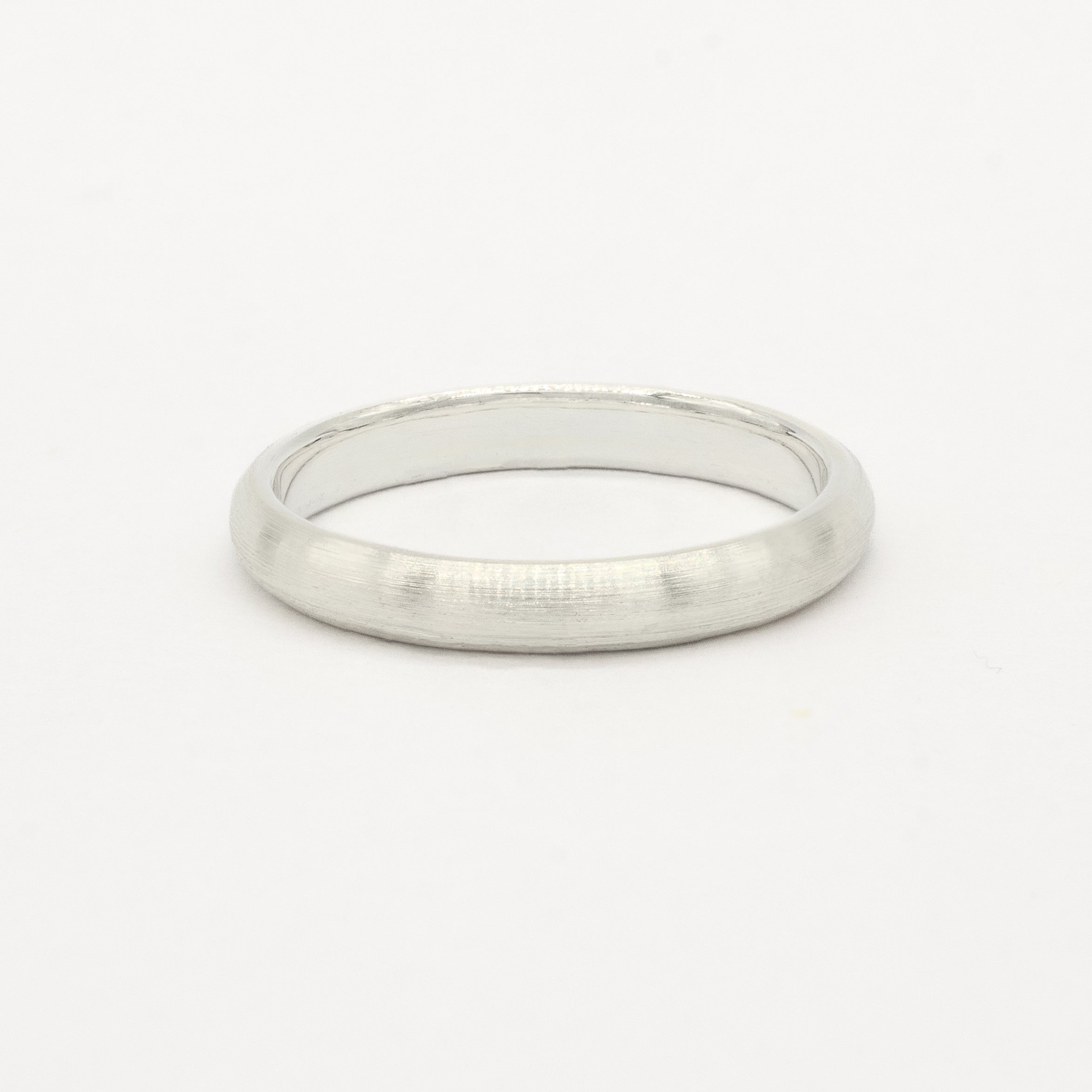 white gold 3mm brushed wedding ring on a white background