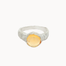 silver textured ring with round orange citrine gemstone on a white background
