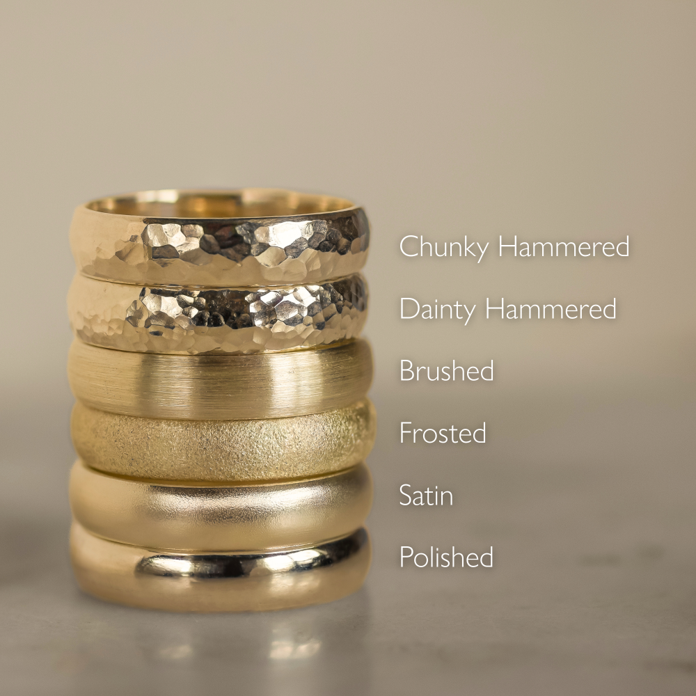 stack of 6 gold wedding rings in different textures