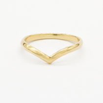 Gold rounded chevron wedding ring with a V-shaped design on a white background
