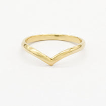 Gold rounded chevron wedding ring with a V-shaped design on a white background
