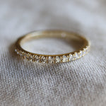 bespoke wedding ring with small diamonds around the band