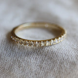 bespoke wedding ring with small diamonds around the band