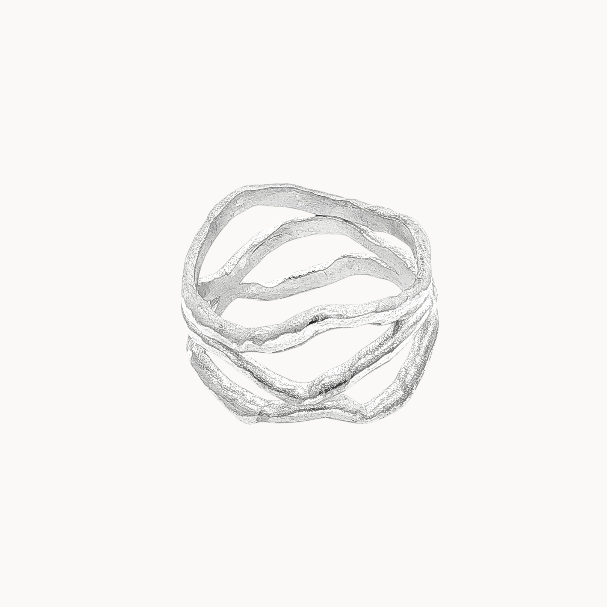 A silver-toned multi-band ring with organic, wavy, flowing lines, presented on a clean off-white background.