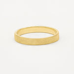 3mm wide frosted flat wedding ring in yellow gold on white background