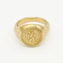 Gold ring with saint christopher engraved design on a white background