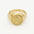 Gold ring with saint christopher engraved design on a white background