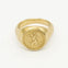 Gold ring with saint christopher engraved design on a white background