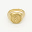 Gold ring with saint christopher engraved design on a white background