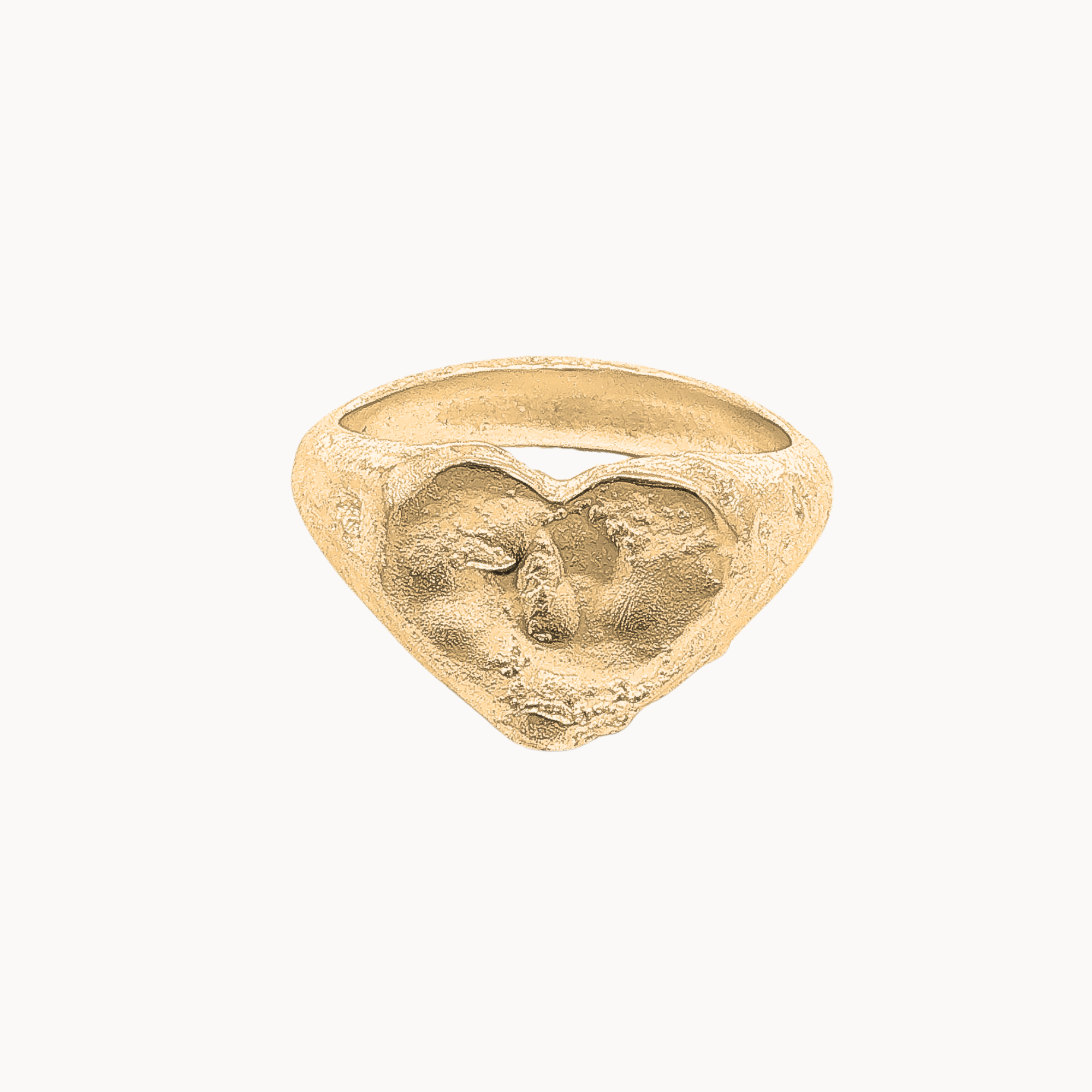 A textured gold ring with a sculpted, organic heart-shaped face, shown on a plain off-white background.