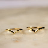 knife edge v shaped wedding ring in 1.3mm width and 2mm width on marble surface