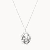Silver necklace with a chunky knotted pendant on a white background