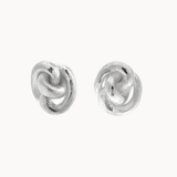 A pair of textured sterling silver knot stud earrings on a clean, off-white background.