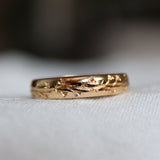 yellow gold ring with lily of the valley engraved design