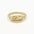 solid gold word ring with the word Loved engraved on a white background