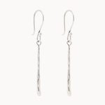 Pair of white gold hook dangle earrings with molten drop detail on a white background