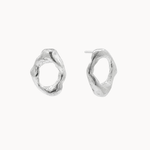 A pair of textured, organic oval silver stud earrings on a clean, off-white background.