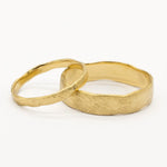 2mm and 5mm wide organic rustic wedding rings on white background