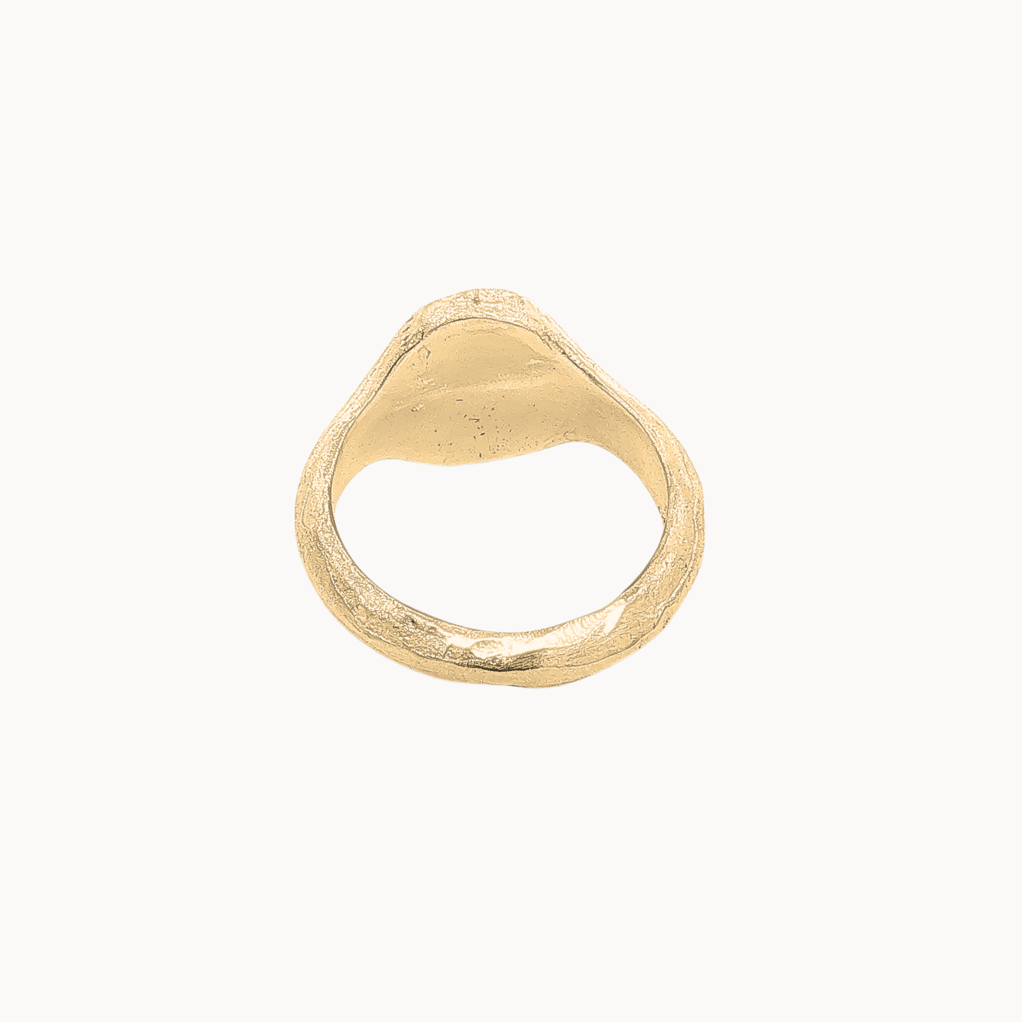 A textured gold signet ring with a triangular face, photographed on a clean, solid off-white background.