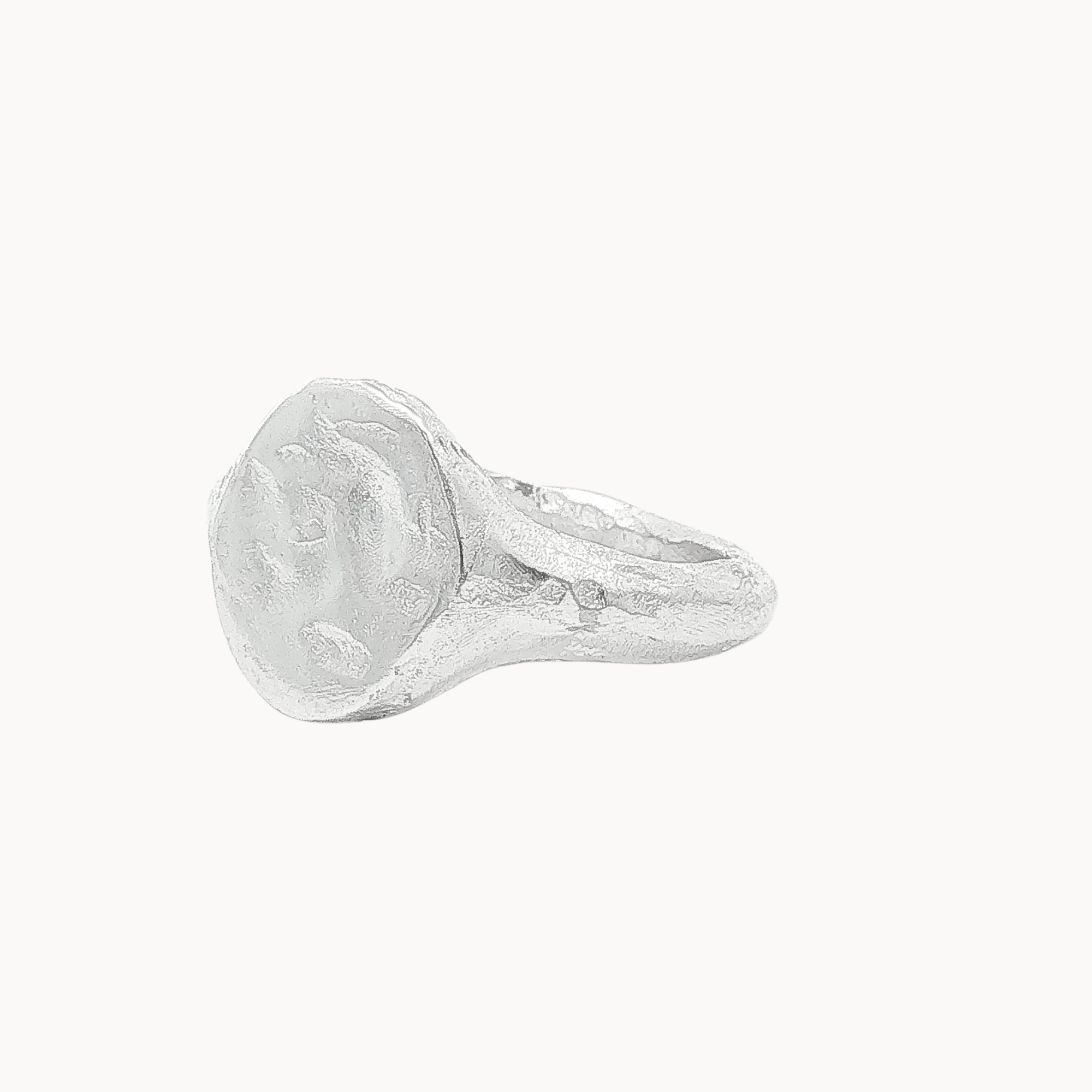 A textured sterling silver signet ring with a chunky, organic-shaped oval face, shown on a plain off-white background.