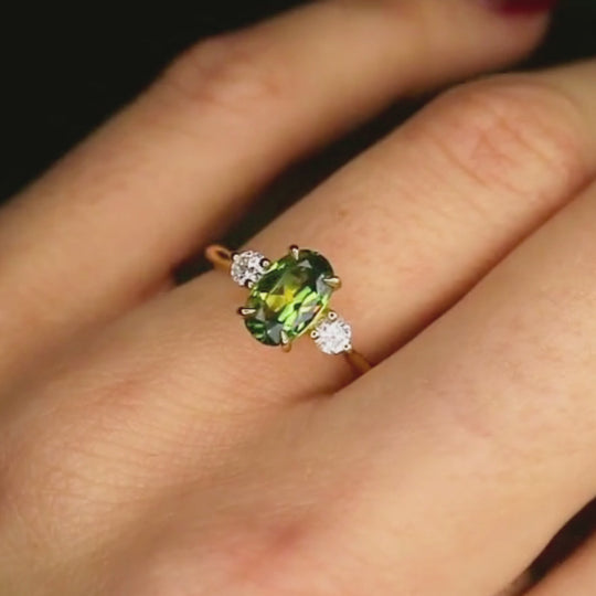 yellow/green sapphire trilogy engagement ring with diamonds moving on hand