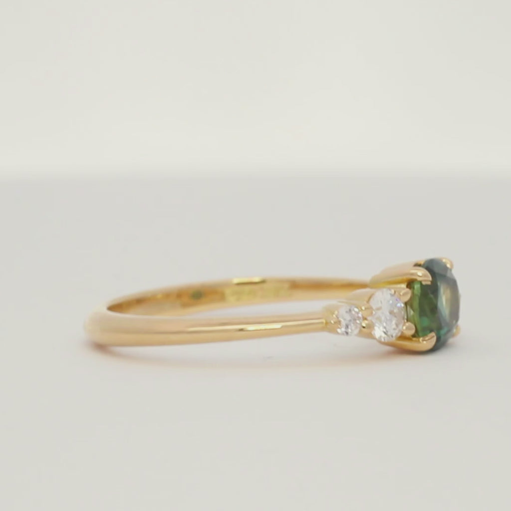 turntable video of an east-west oval sapphire engagement ring spinning