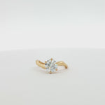 video of curved engagement ring with diamond on a turntable