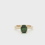 9ct Gold Green Sapphire Solitaire Engagement Ring with Organic Band spinning on turntable
