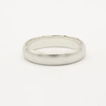 White gold satin wedding ring on a white background