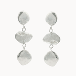 dangle earrings each with three pebble-like disks on a white background